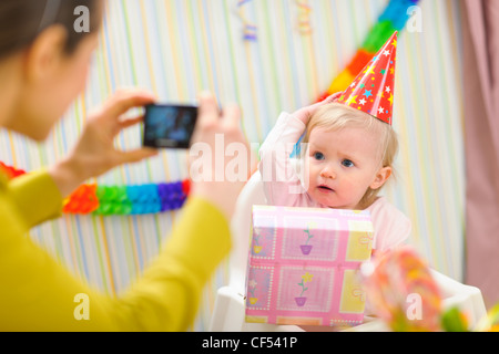 Mother making photos of babys first birthday Stock Photo