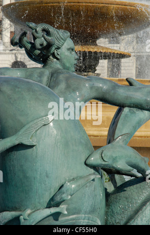 Close up of mermaid and fish statue in Trafalgar Square fountain. Stock Photo