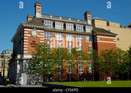 A row of small trees beside The Forbury Hotel in Reading. Stock Photo