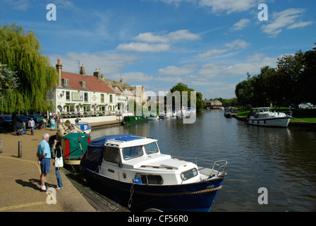 A view of boats moored on the River Great Ouse looking towards Cutter Inn. Stock Photo