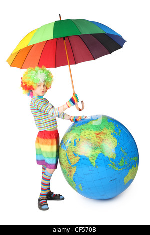 boy in clown dress with umbrella and big globe isolated on white background Stock Photo