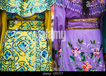 Embroidered womens dresses viewed from behind Thailand Bangkok Asia asian Thailand thai chinese imperial traditiional costume Stock Photo