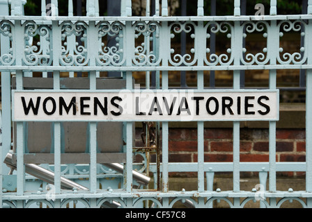 A close up of a womens lavatories sign on iron railings in West Smithfield Stock Photo