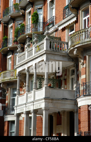 Ornate red brick apartment building at Campden Hill Court. Stock Photo