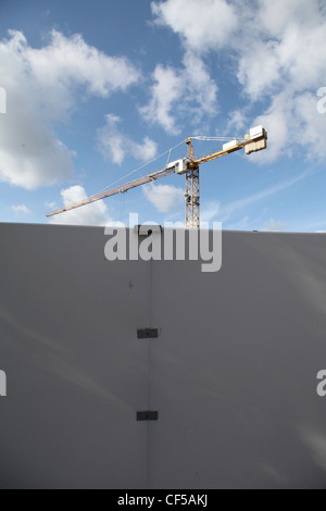 Germany, Berlin, View of construction site with wall and crane Stock Photo