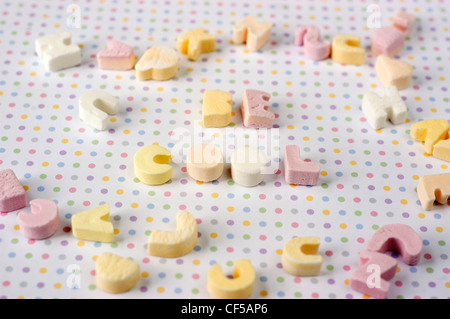 Sugar letter shaped sweets spelling the words be cool Stock Photo