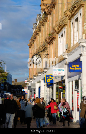 Shoppers outside shop fronts in  Bromley High Street. Stock Photo