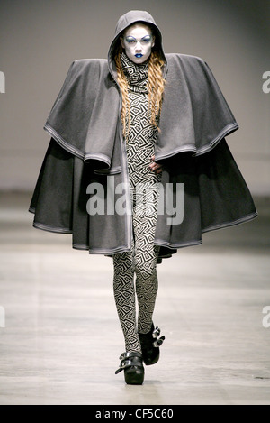 Gareth Pugh London Ready to Wear Autumn Winter Black and white patterned jumpsuit, grey cape oversize shoulderpads and hood, Stock Photo