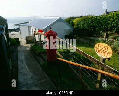 The village post office at Baile Mor overlooking St Ronan's Bay and the Sound of Iona. Stock Photo