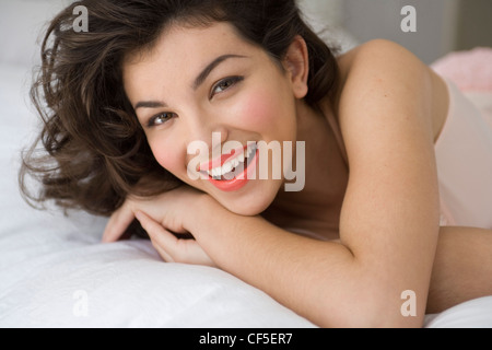 Girl showing thong while sitting on table with friends Stock Photo