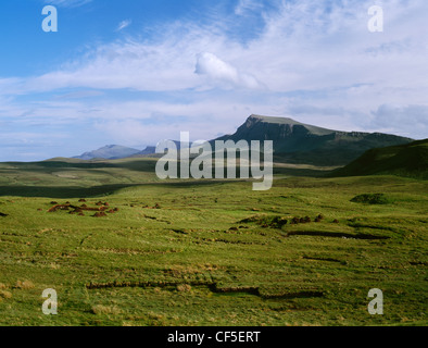 Looking southwards from the Quiraing road between Staffin and Uig at moorland, peat cuttings and stacks with part of the Trotter Stock Photo