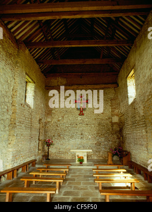 Interior of the nave of St Peter's 7th-century chapel, built of reused Roman materials on the site of Othona Roman fort. It form Stock Photo