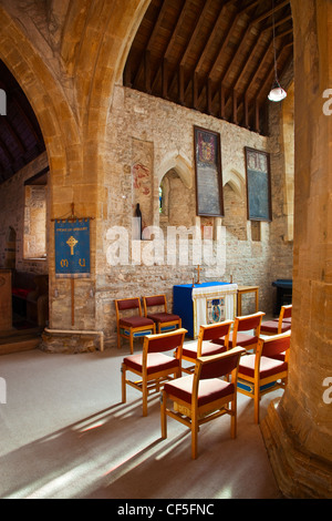 View of chairs arranged in front of a small altar in Saint Gregory's church. Stock Photo