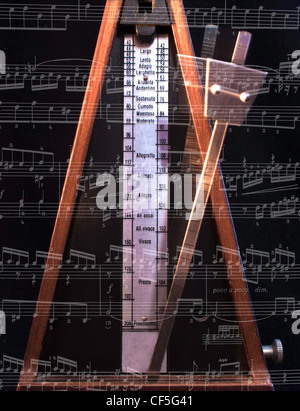 Old metronome with blur motion on the black Stock Photo