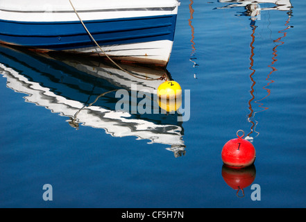 Reflections of a boat in Whitby Harbour. Stock Photo