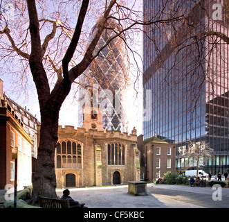 Partial view of 30 St Mary Axe building. Infamously known as 'the Gherkin' due to its 3D oval shape, it is one of the first land Stock Photo