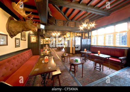 The interior of a traditional British country pub. Around 90% of beer sold in the UK is produced in the UK and 28 million pints Stock Photo