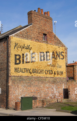 Old advertising hoarding for Bile beans on the side of a brick building. Stock Photo