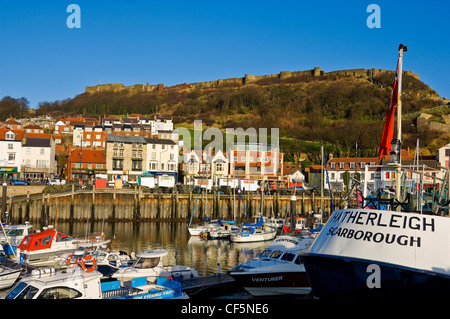 Deep sea trawler Hatherleigh moored in Scarborough Inner Harbour with the Castle in the background. Stock Photo