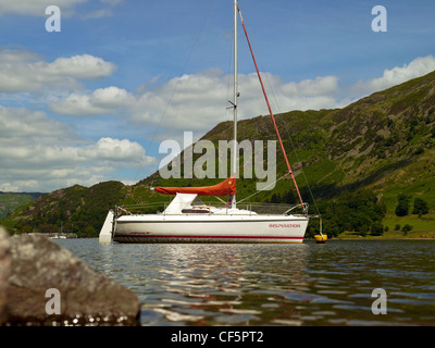 A yacht moored on Ullswater, 'England's most beautiful lake' in the Lake District National park. Stock Photo