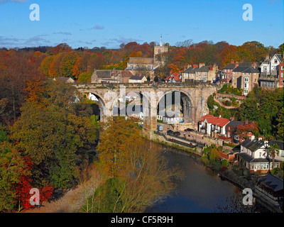 The Victorian railway viaduct completed in 1851, spanning the River Nidd in autumn. Stock Photo