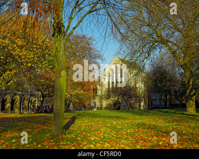 13th century York Minster Library from Deans Park in autumn. Stock Photo