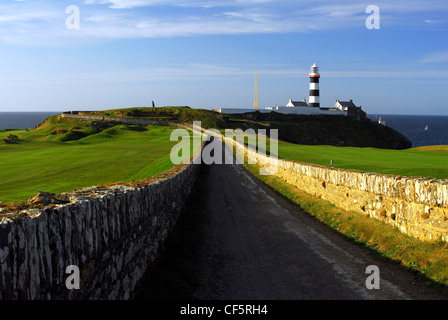 A view to the lighthouse from Old Head of Kinsale Golf Course in Cork. Stock Photo