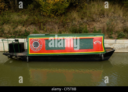 A canal boat moored on Wey and Arun canal near Loxwood. Stock Photo