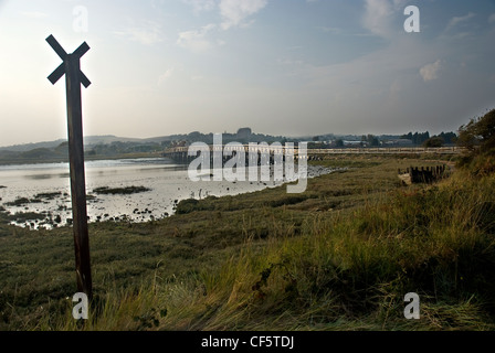 A view across the River Adur towards the restored old Shoreham Toll Bridge and Lancing College Chapel. Stock Photo