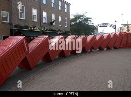 Out of Order sculpture by David Mach in Kingston upon Thames. The sculpture is formed from disused telephone boxes tipped on the Stock Photo