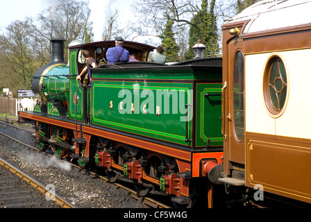 A steam train pulling out of Sheffield Park Station on the Bluebell Railway. Stock Photo