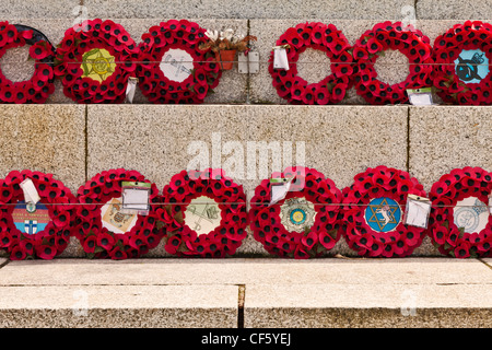 Poppy wreaths laid in remembrance at the foot of the war memorial on the seafront at Blackpool. Stock Photo