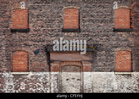 Bricked up windows and door of an old warehouse. Stock Photo