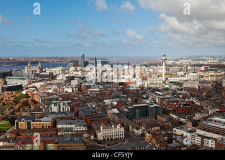 Aerial view over the city towards the Mersey Estuary, featuring the prominent and iconic landmarks of the Three Graces and the R Stock Photo