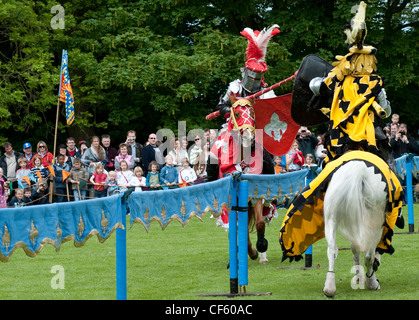 Two knights battle in a jousting tournament at Hedingham Castle. Stock Photo