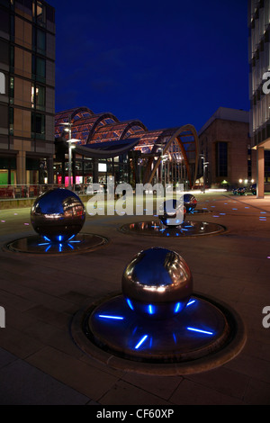 Water features at night outside the Winter Garden in Sheffield. The garden is one of the largest temperate glasshouses to be bui Stock Photo