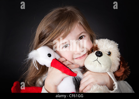 little girl with her favourite toys Stock Photo