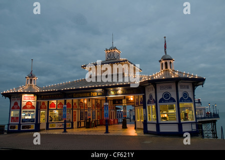 A view of the entrance to Eastbourne Pier at dusk. Stock Photo