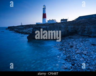 The red and white striped Portland Bill Lighthouse, built in 1906, at twilight. Stock Photo