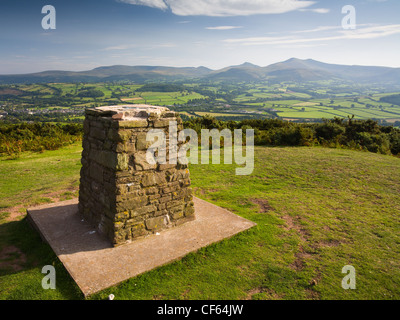 Trig point on top of Pen-y-Crug hillfort overlooking Brecon and the Usk valley in the Brecon Beacons National Park. Stock Photo