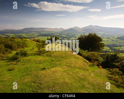 Pen-y-Crug hillfort overlooking the Usk valley towards Pen y Fan and Corn Du in the Brecon Beacons National Park. Stock Photo