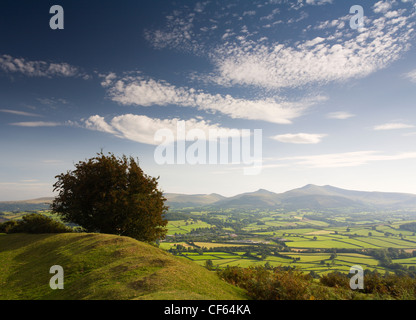 Pen-y-Crug hillfort overlooking the Usk valley towards Pen y Fan and Corn Du in the Brecon Beacons National Park. Stock Photo