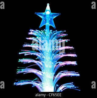 Illumination as  souvenir as  conifer with  star on  black background Stock Photo