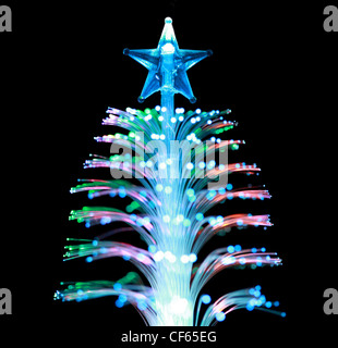 Souvenir lamp in form conifer with  star on  black background Stock Photo