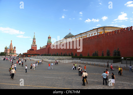 MOSCOW-JUNE 21 Tourists Red Sguare near Kremlin wall June 21 2010 Moscow Russia sguare itself around 330 meters (1100 ft) long Stock Photo