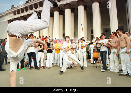 MOSCOW MAY 15 Two man dance real capoeira performance at All-Russia Exhibition Center May 15 2010 Moscow Russia Capoeira Stock Photo