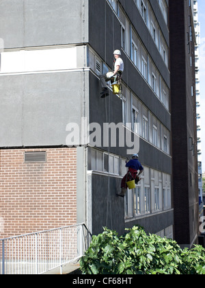 Window cleaners in the city centre of Manchester. Stock Photo