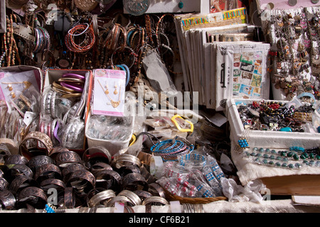 Curios for sale in Cairo, a collection of trinkets, jewellery, bracelets, rings, stamps and many other stuff that tourists buy Stock Photo
