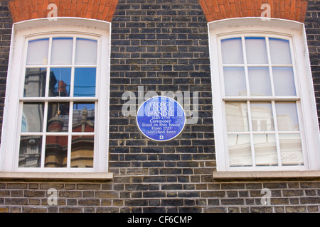 A blue English Heritage plaque on the wall of a house to celebrate that the composer George Frideric Handel 1685 -1759 lived the Stock Photo