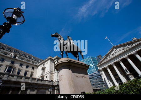 A statue of the Duke of Wellington outside the Royal Exchange. The statue is cast from the guns captured from the French in batt Stock Photo